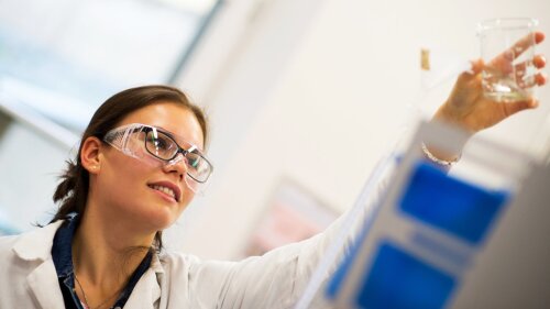 Student filling a burette (practical course "Titration")