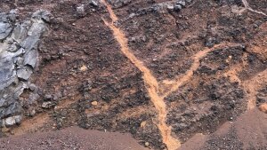 Outcrop of cinder cone with pressed tertiary clays