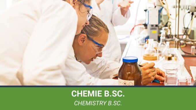 Two female students during a practical laboratory course in chemistry